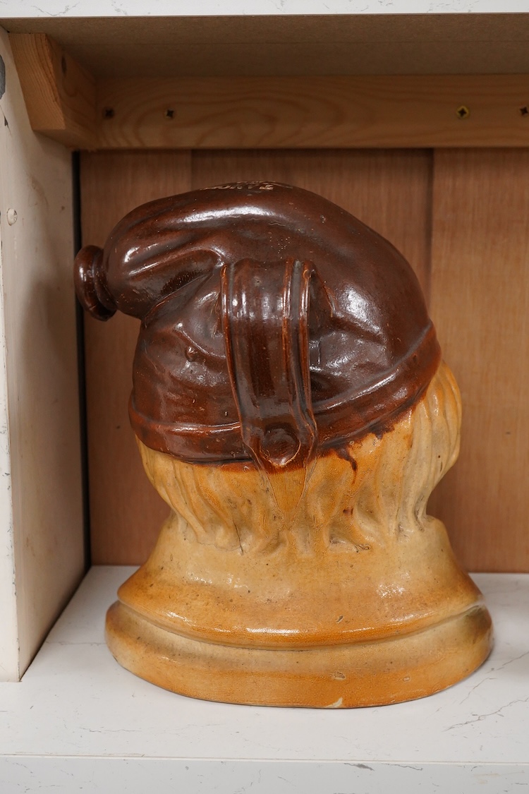 A large 19th century Johnny Souter, salt glazed stoneware spirit flask impressed T A Moss wine and spirit Merchant Bell Mount street Grosvenor square, 28cm high
